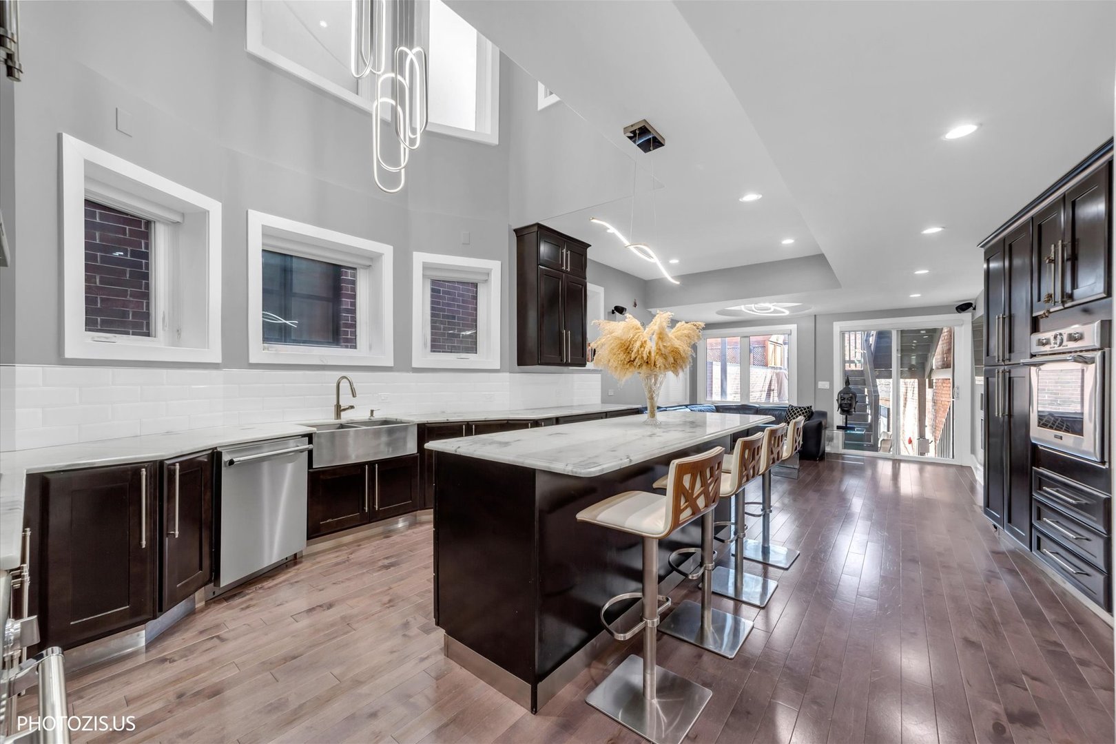 461 West Melrose Street Chicago, IL 60657 - Photo 16 of 83 a dining hall with stainless steel appliances granite countertop a stove and a table of the kitchen