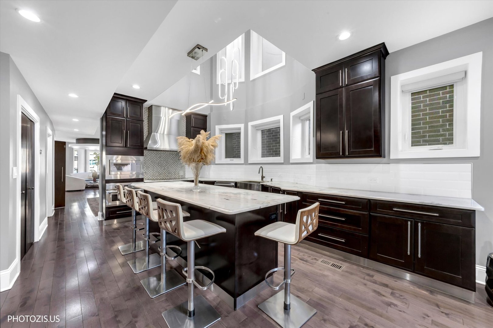 461 West Melrose Street Chicago, IL 60657 - Photo 22 of 83 an open kitchen with granite countertop a stove and a sink