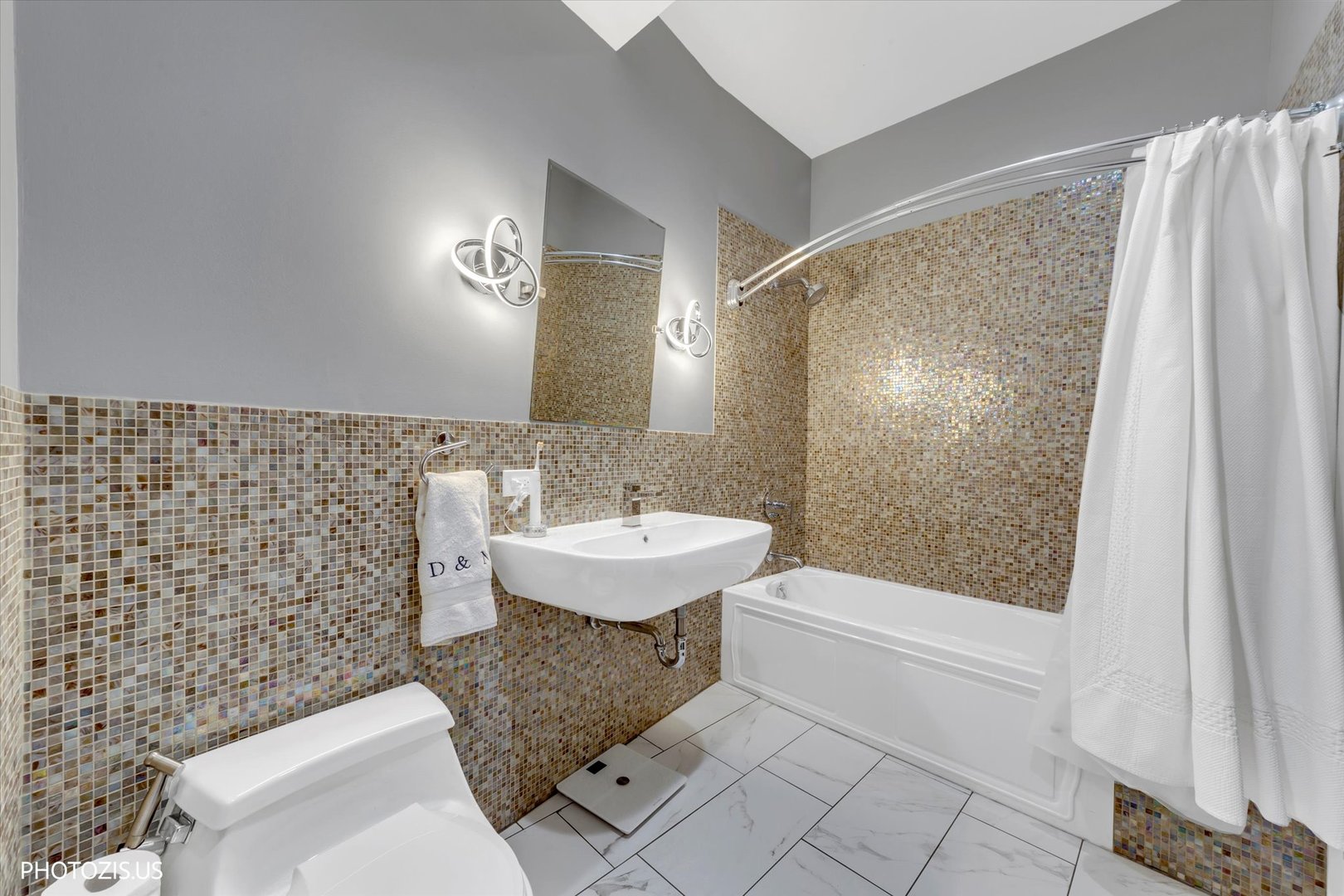 461 West Melrose Street Chicago, IL 60657 - Photo 38 of 83 a bathroom with a sink a toilet and shower