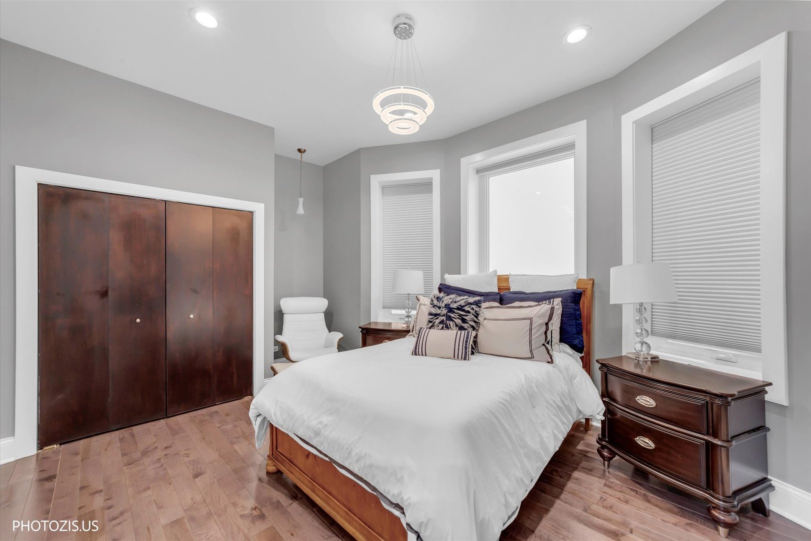 461 West Melrose Street Chicago, IL 60657 - Photo 47 of 83 a bedroom with a bed and a chandelier