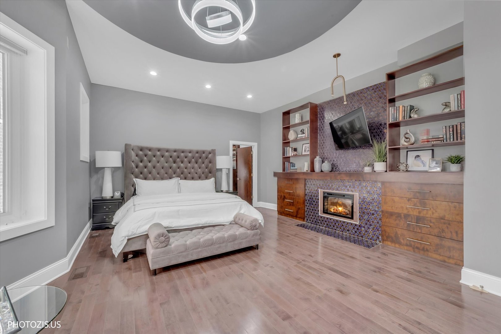 461 West Melrose Street Chicago, IL 60657 - Photo 54 of 83 a spacious bedroom with a bed and a flat screen tv