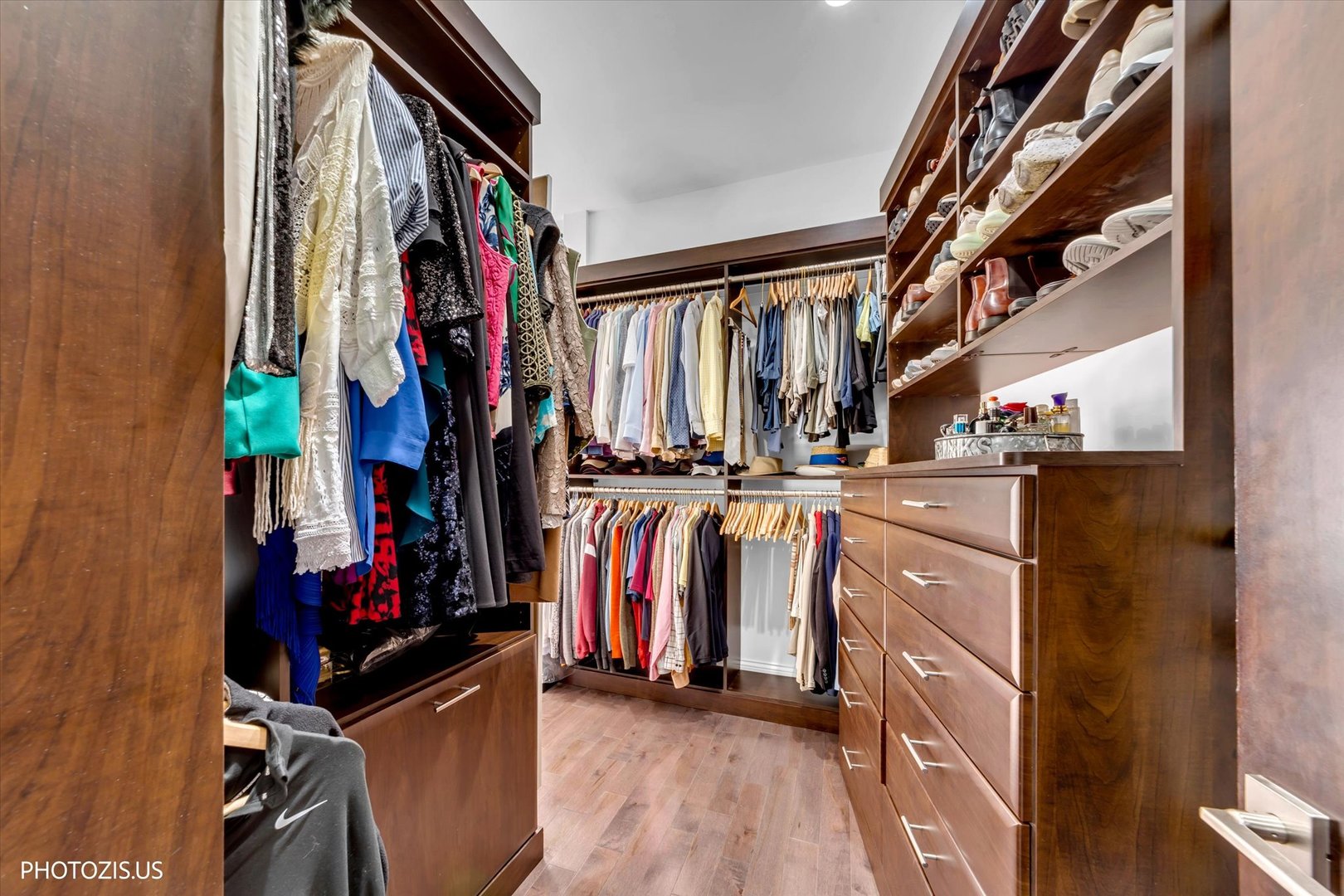 461 West Melrose Street Chicago, IL 60657 - Photo 57 of 83 a view of walk in closet with clothes