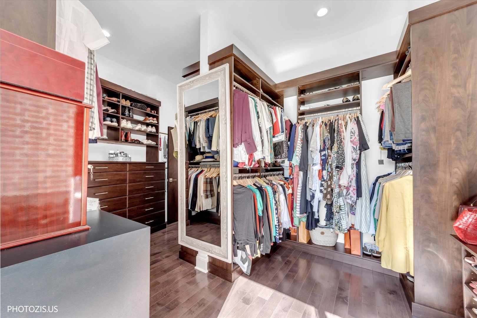 461 West Melrose Street Chicago, IL 60657 - Photo 58 of 83 a view of walk in closet with clothes and shoes