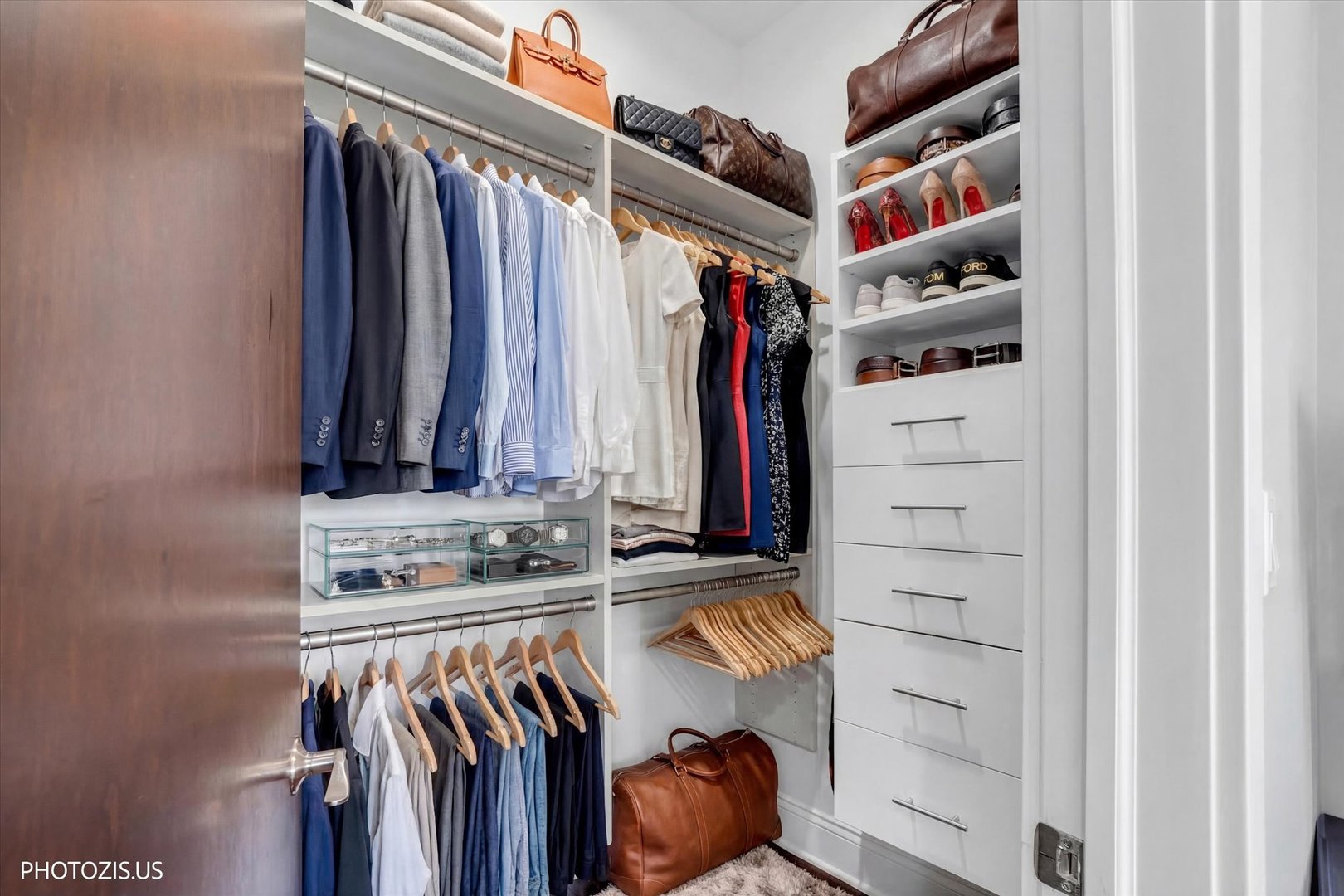 461 West Melrose Street Chicago, IL 60657 - Photo 59 of 83 a view of walk in closet with clothes and shoes