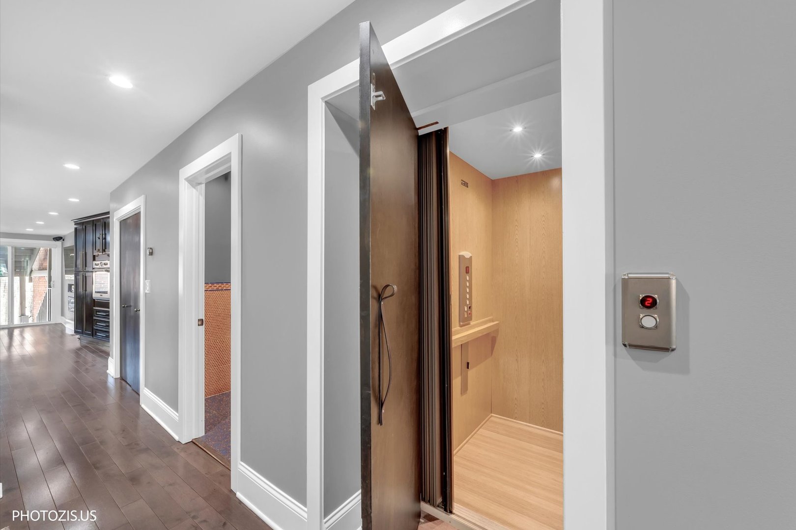 461 West Melrose Street Chicago, IL 60657 - Photo 9 of 83 a view of a hallway with wooden floor