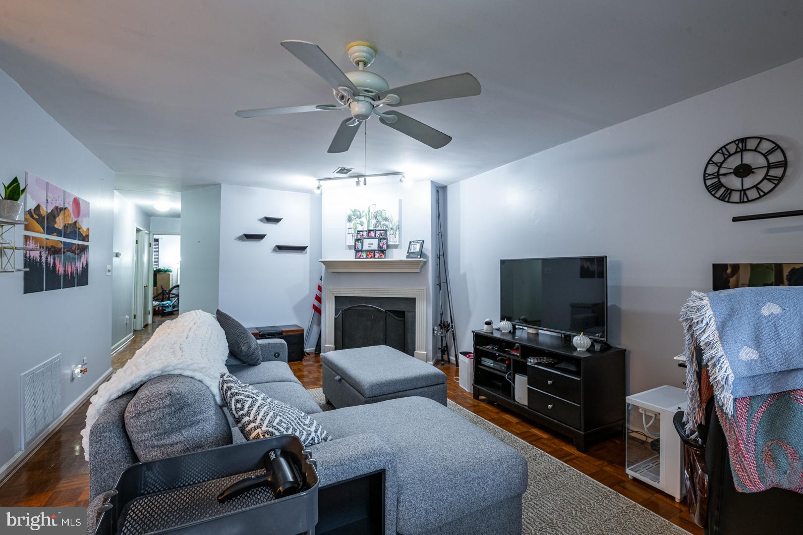 16B Fairway Road Reading, PA 19607 - Photo 5 of 14 a living room with furniture a fireplace and a flat screen tv