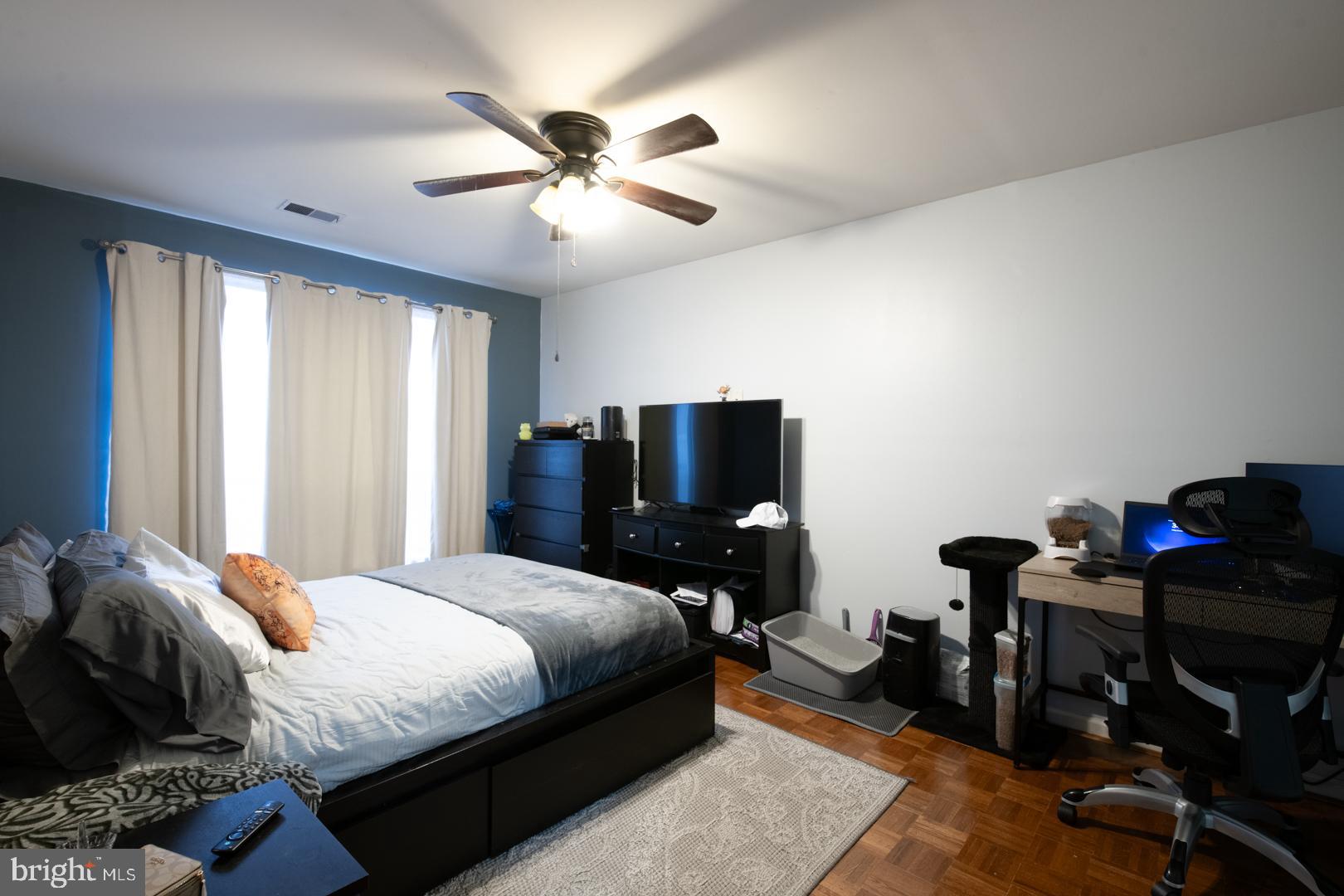 16B Fairway Road Reading, PA 19607 - Photo 9 of 14 a bedroom with a bed and wooden floor