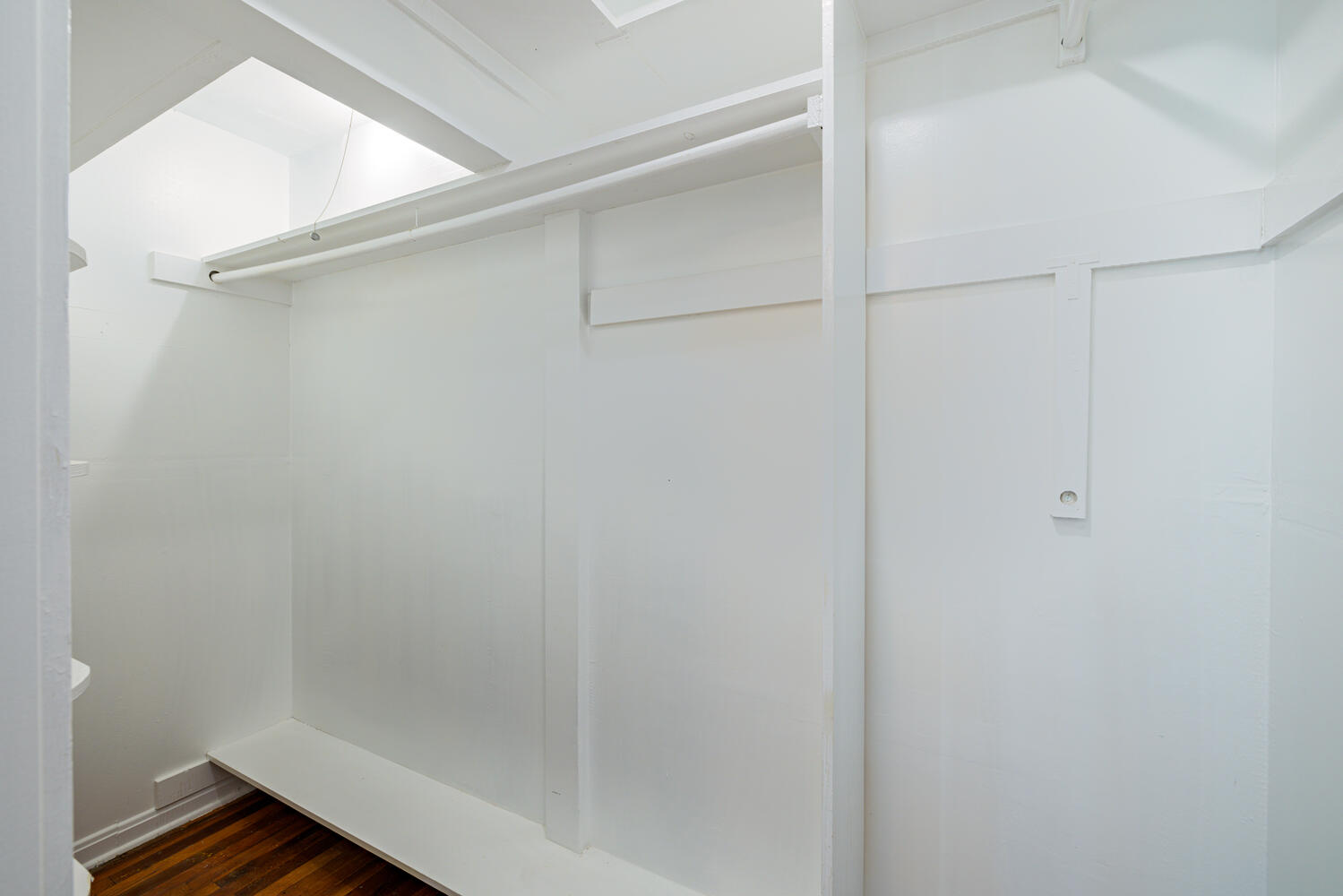 1400 Ruth Avenue Austin, TX 78757 - Photo 16 of 29 Ample closet space features hardwood flooring and built-in shelving.