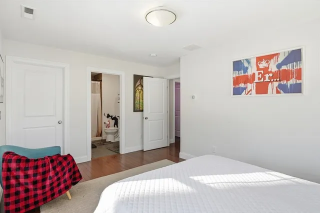 a bedroom with a bed and furniture