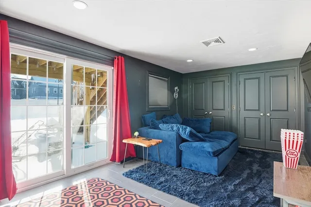 a living room with furniture and a rug