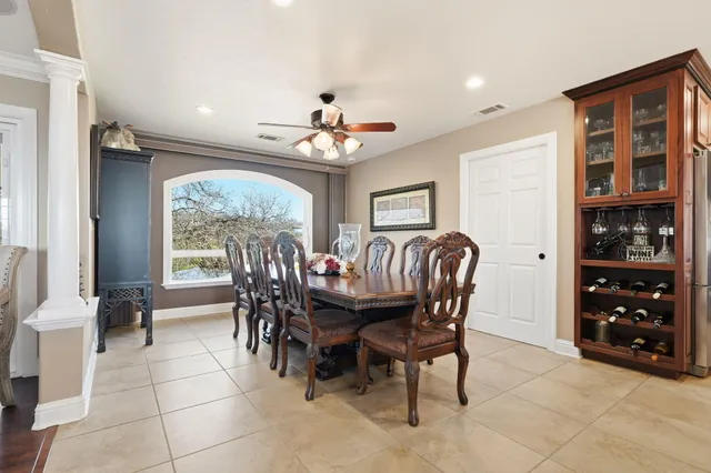 a dining room with furniture and window