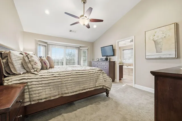 a bedroom with a bed and a fireplace