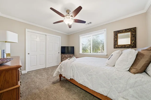 a bathroom with a granite countertop sink a mirror and a shower