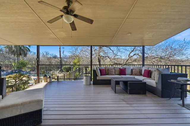 a view of swimming pool with sitting area
