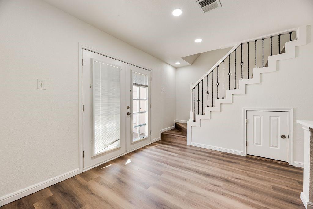 190 Merlin Way Euless, TX 76039 - Photo 15 of 39 Small door in photos I under the stairs and contains the hot water heater and small storage area.