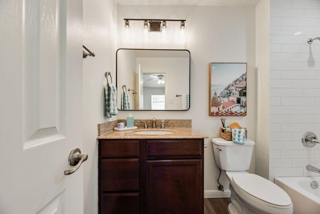 190 Merlin Way Euless, TX 76039 - Photo 23 of 39 Vanity in bathroom #1 with updated light fixtures and mirror.