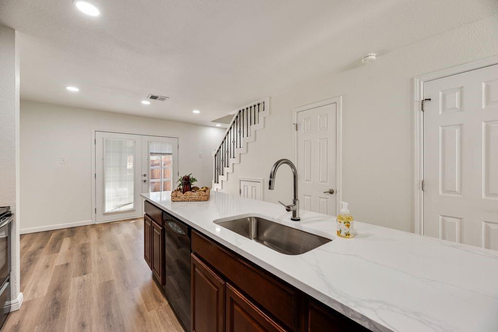 190 Merlin Way Euless, TX 76039 - Photo 9 of 39 Door across from sink is half bath