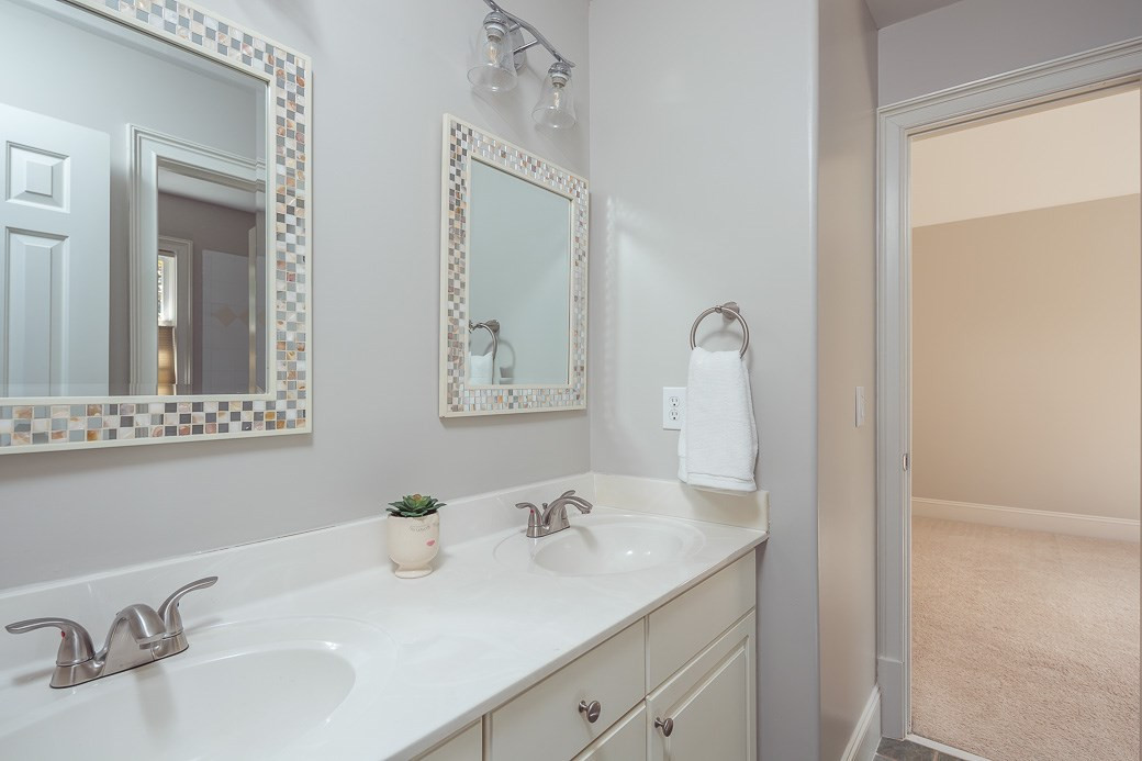 4901 Grilse Way Raleigh, NC 27613 - Photo 15 of 19 Secondary bathroom features a double vanity that's convenient for family members and guests! BATHROOM