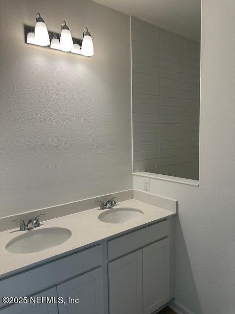 156 Camphor Laurel Road St. Augustine, FL 32092 - Photo 10 of 34 a bathroom with a sink and a mirror