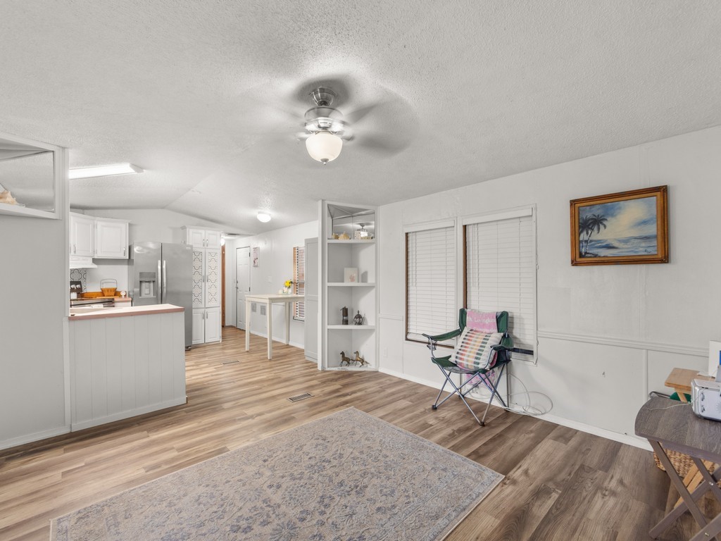7380 129th Street Sebastian, FL 32958 - Photo 14 of 36 a large bedroom with a bed and glass table