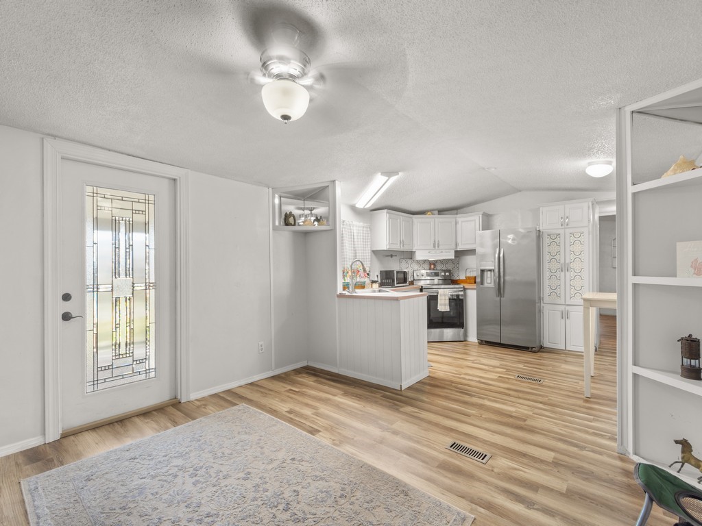 7380 129th Street Sebastian, FL 32958 - Photo 15 of 36 a view of a kitchen with wooden floor