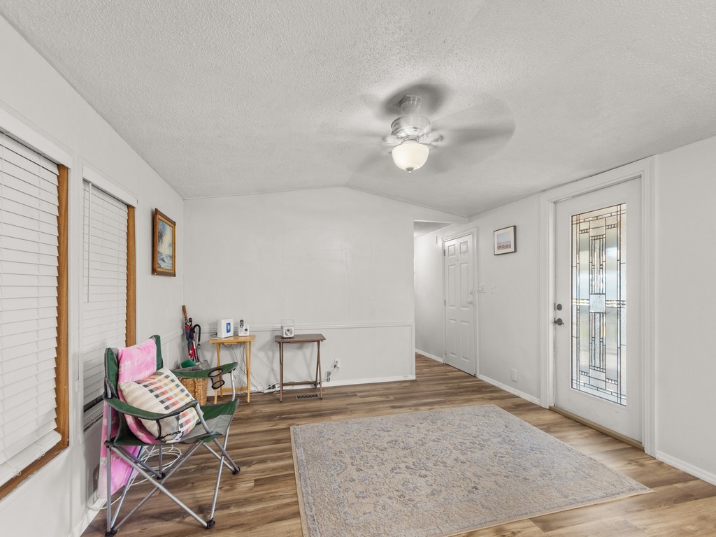 7380 129th Street Sebastian, FL 32958 - Photo 18 of 36 a living room with furniture and a ceiling fan