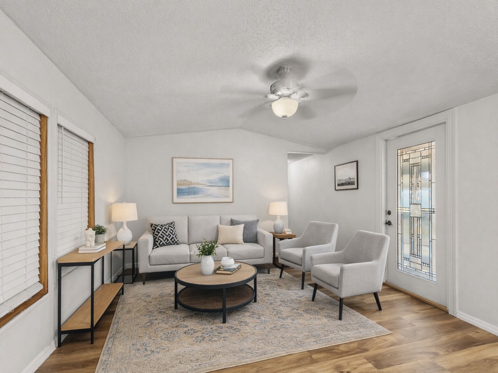 7380 129th Street Sebastian, FL 32958 - Photo 19 of 36 a living room with furniture and wooden floor