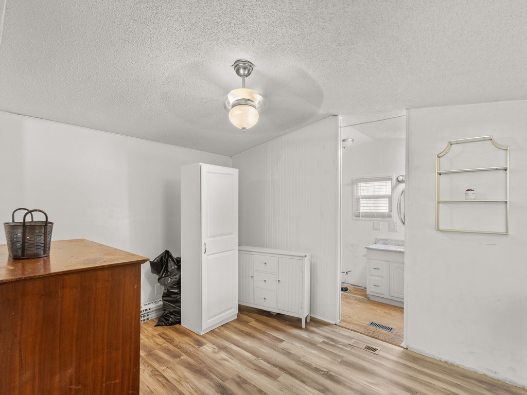 7380 129th Street Sebastian, FL 32958 - Photo 22 of 36 a view of a kitchen from the hallway