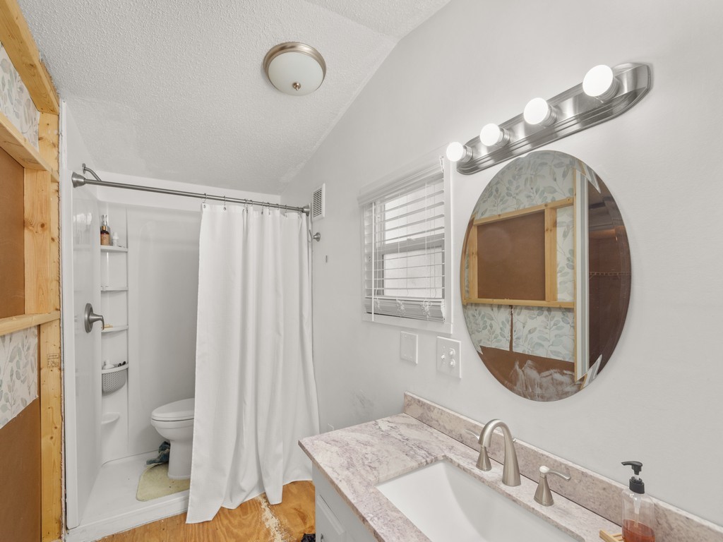 7380 129th Street Sebastian, FL 32958 - Photo 24 of 36 a bathroom with a sink and a mirror