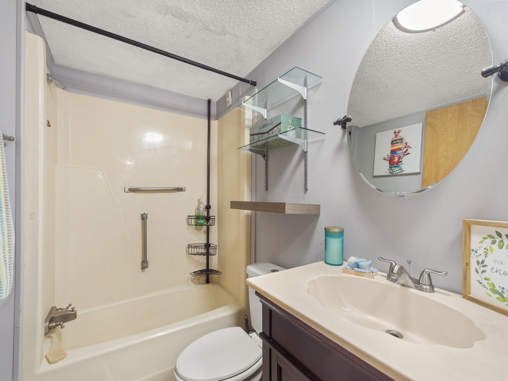 7380 129th Street Sebastian, FL 32958 - Photo 28 of 36 a bathroom with a sink toilet and shower