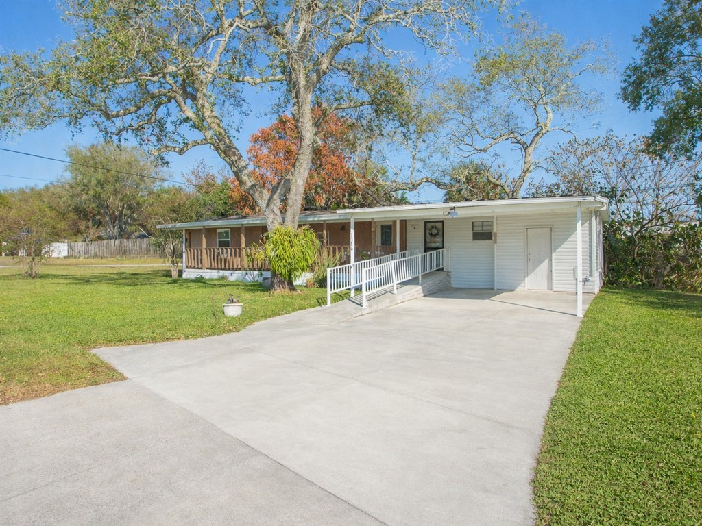7380 129th Street Sebastian, FL 32958 - Photo 8 of 36 a view of house with outdoor space and swimming pool
