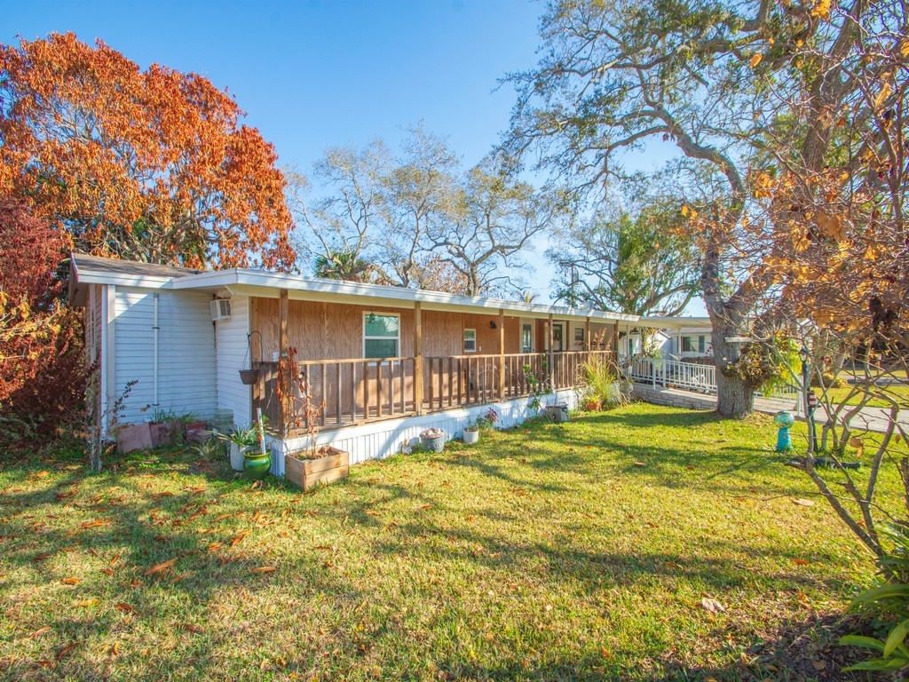 7380 129th Street Sebastian, FL 32958 - Photo 9 of 36 a view of a house with backyard and sitting area
