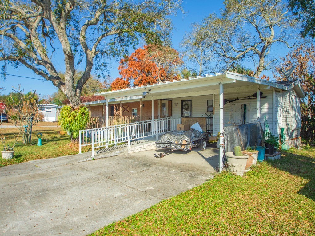 7380 129th Street Sebastian, FL 32958 - Photo 10 of 36 a view of a house with backyard porch and sitting area
