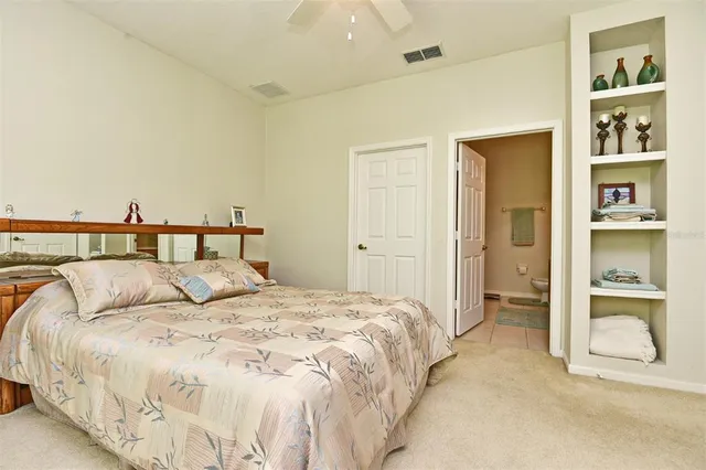 a bedroom with a bed and walk in closet