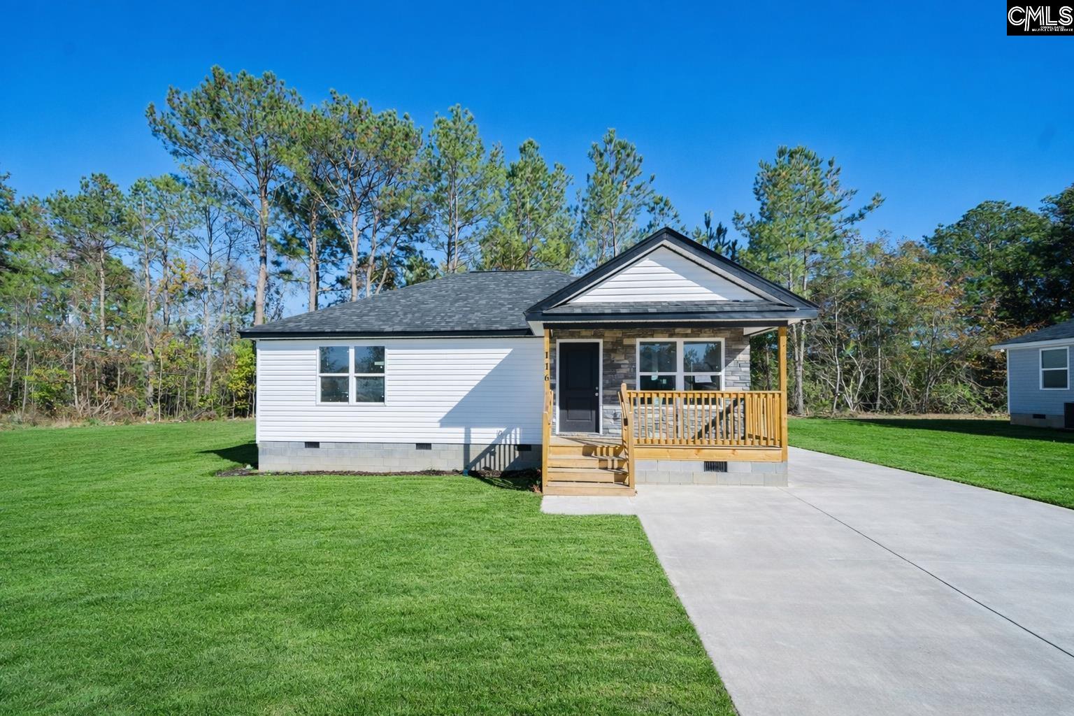 116 Sunny Acres Road Eastover, SC 29044 - Photo 1 of 40 a front view of a house with garden