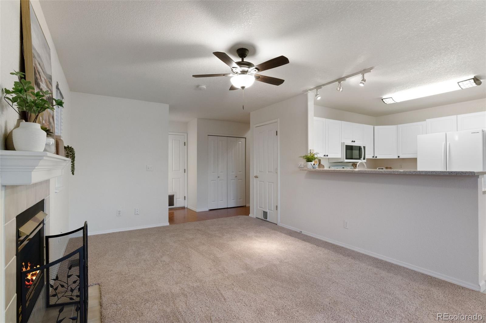 12734 Eudora Drive Thornton, CO 80241 - Photo 15 of 49 a view of an empty room and kitchen view
