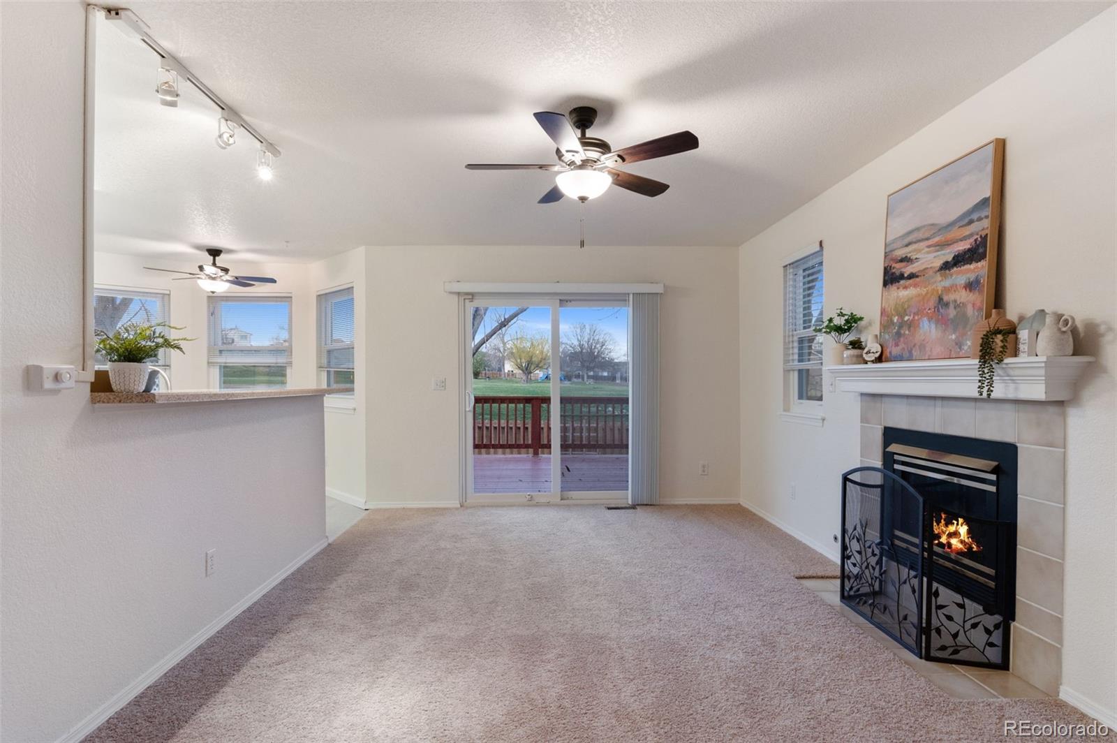 12734 Eudora Drive Thornton, CO 80241 - Photo 17 of 49 a view of a livingroom with a fireplace and window