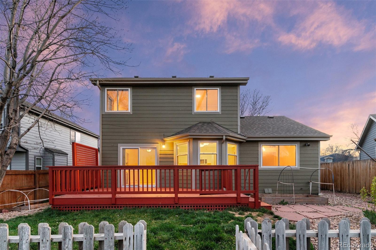 12734 Eudora Drive Thornton, CO 80241 - Photo 2 of 49 a front view of a house with a yard