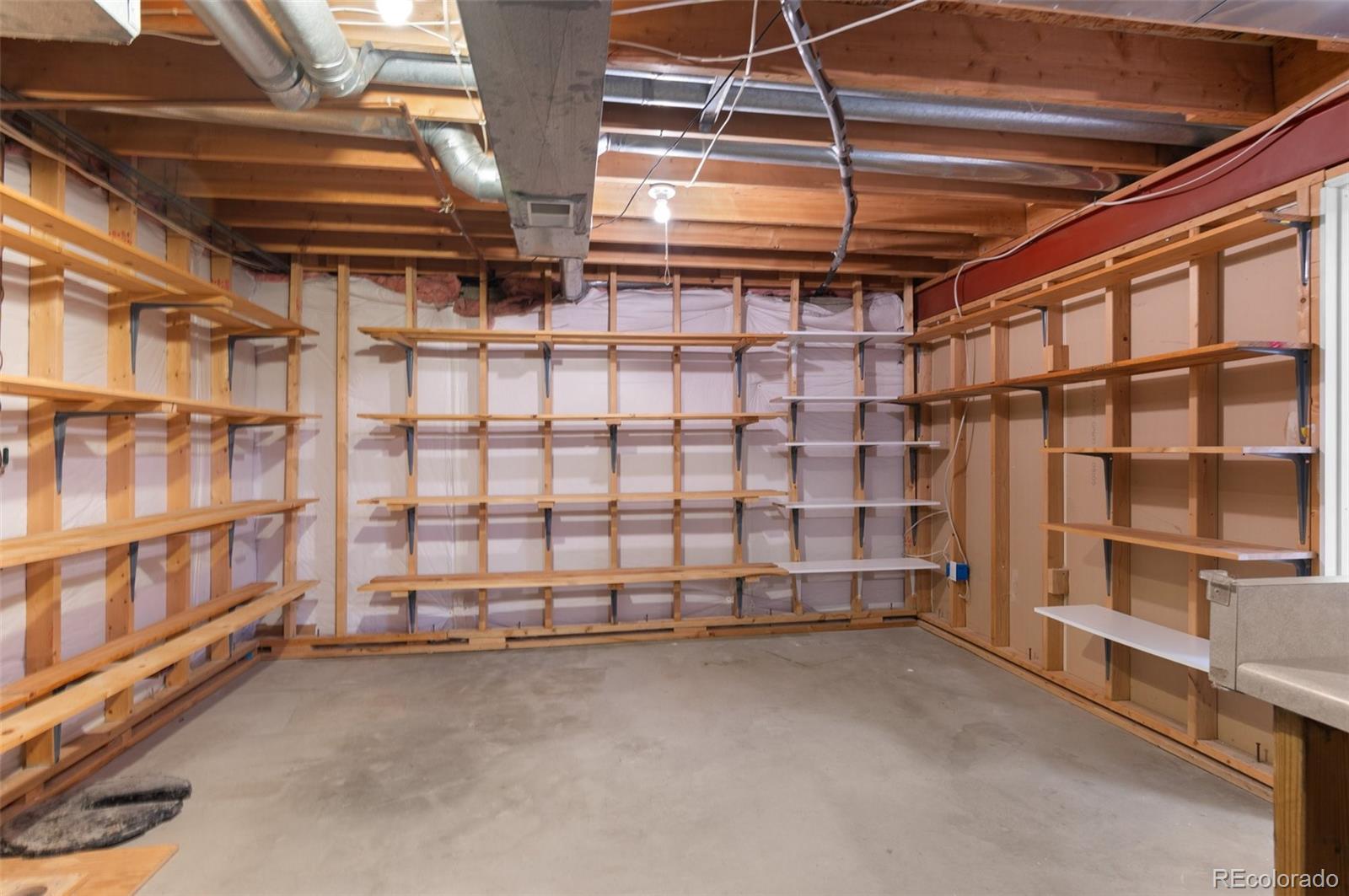 12734 Eudora Drive Thornton, CO 80241 - Photo 29 of 49 a view of a room with racks on the wall