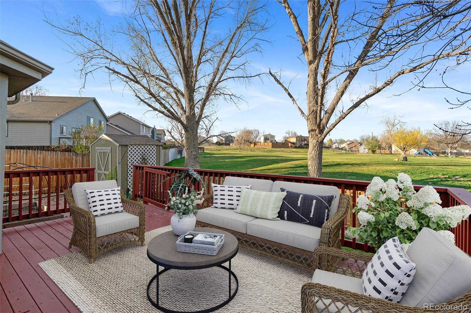 12734 Eudora Drive Thornton, CO 80241 - Photo 35 of 49 a outdoor living space with furniture and a potted plant