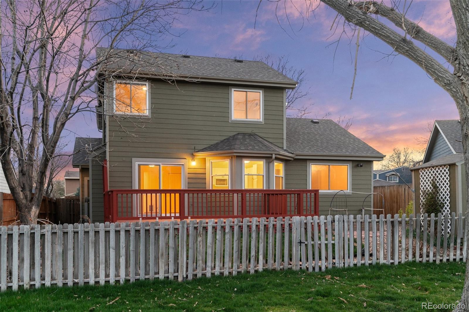 12734 Eudora Drive Thornton, CO 80241 - Photo 41 of 49 a front view of a house with a garden