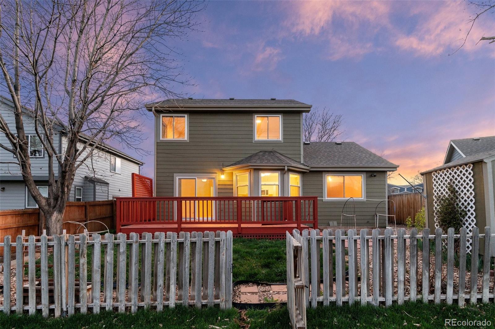 12734 Eudora Drive Thornton, CO 80241 - Photo 42 of 49 a front view of a house with a yard