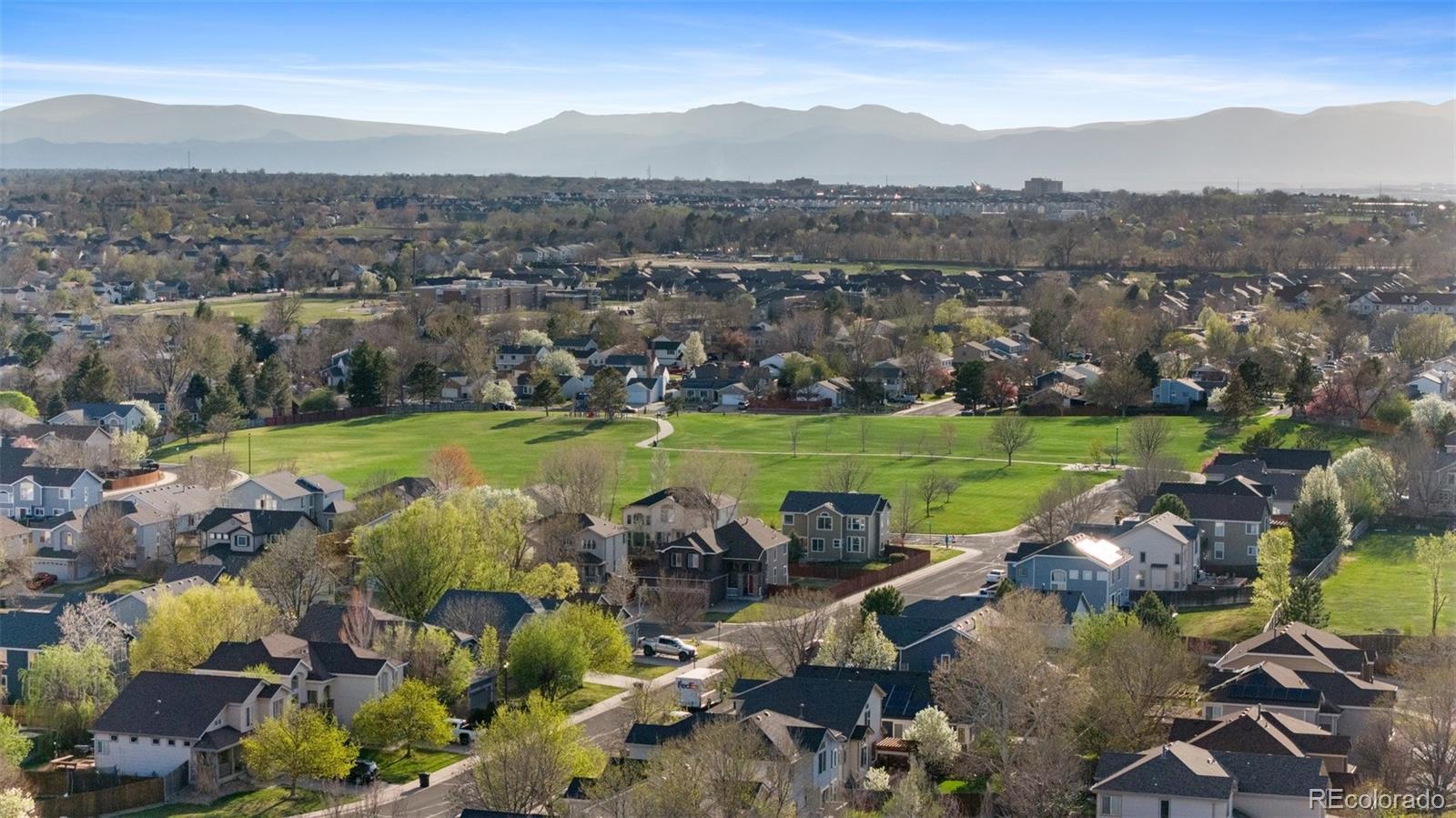 12734 Eudora Drive Thornton, CO 80241 - Photo 47 of 49 a view of a city with mountains in the background
