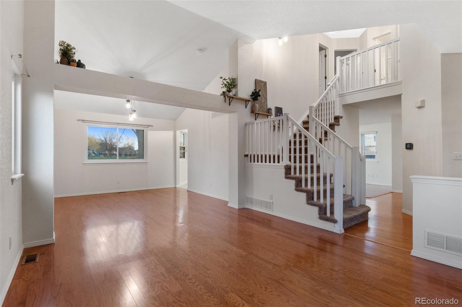 12734 Eudora Drive Thornton, CO 80241 - Photo 7 of 49 a view of entryway with wooden floor