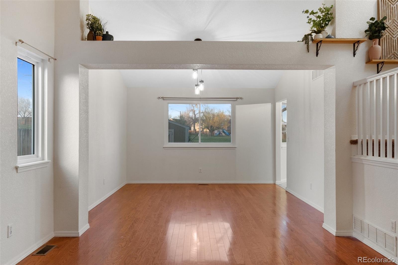 12734 Eudora Drive Thornton, CO 80241 - Photo 8 of 49 wooden floor in an empty room