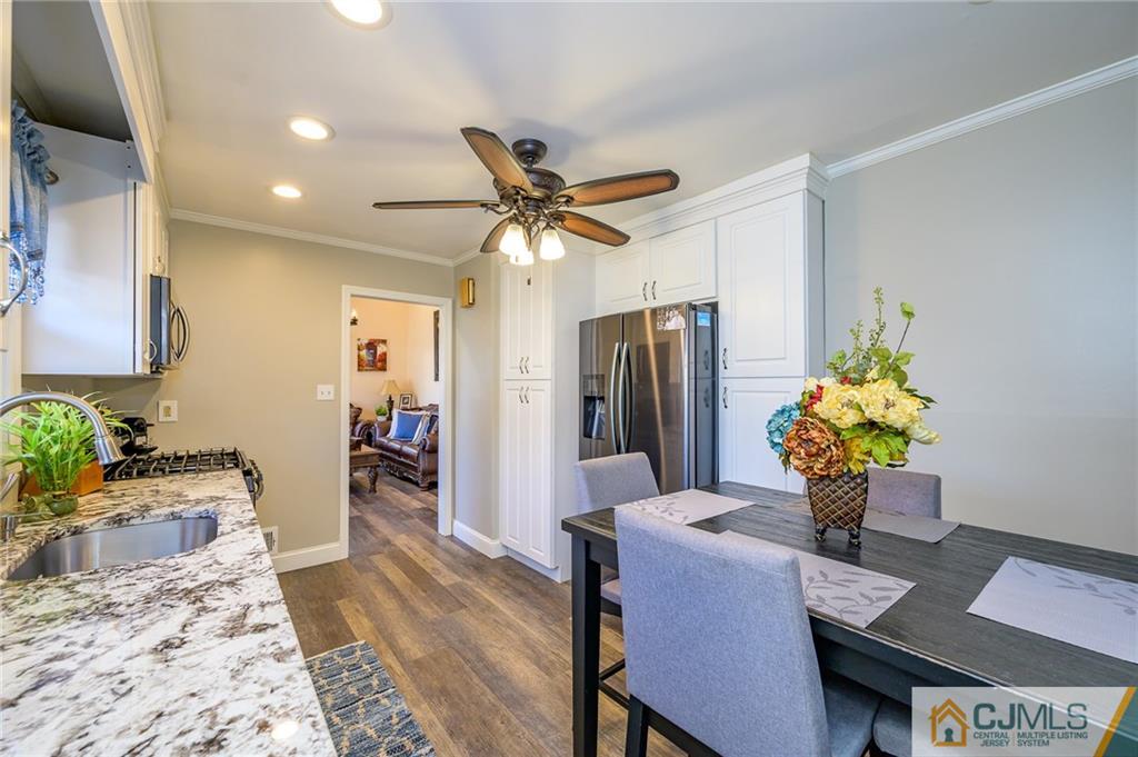 14 Sine Road Edison, NJ 08817 - Photo 12 of 33 a dining room with furniture and a chandelier