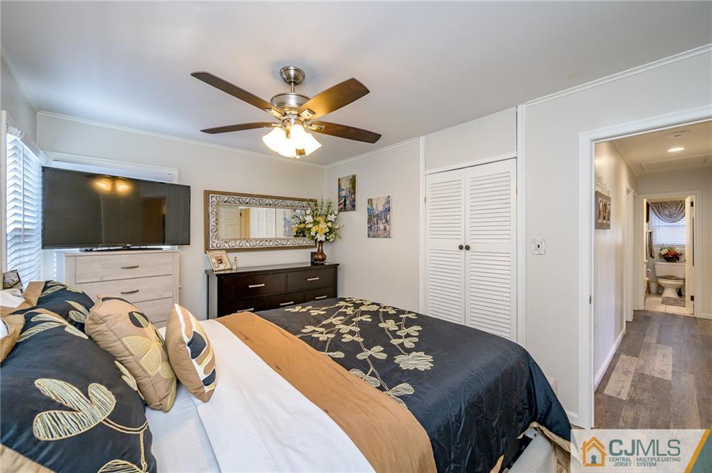 14 Sine Road Edison, NJ 08817 - Photo 16 of 33 a bedroom with a bed and a flat screen tv