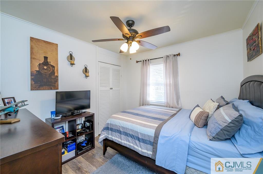 14 Sine Road Edison, NJ 08817 - Photo 19 of 33 a bedroom with a bed and a flat screen tv