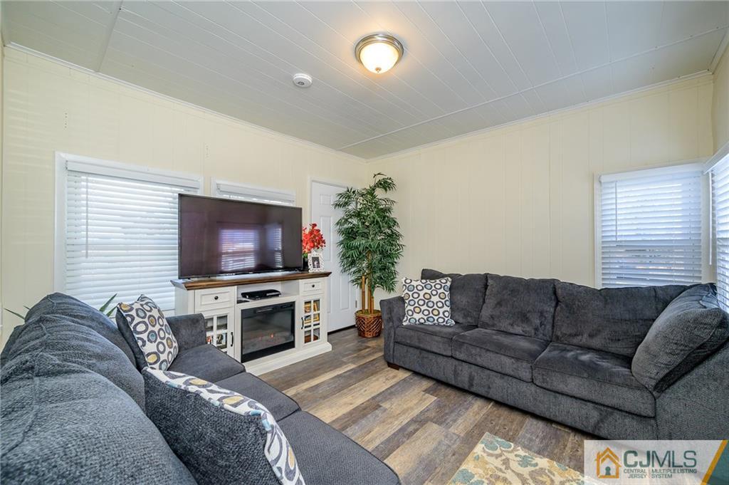 14 Sine Road Edison, NJ 08817 - Photo 26 of 33 a living room with furniture and a flat screen tv