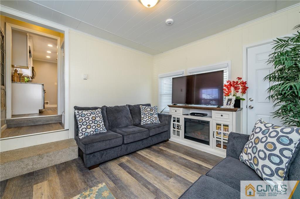 14 Sine Road Edison, NJ 08817 - Photo 27 of 33 a living room with furniture and a flat screen tv